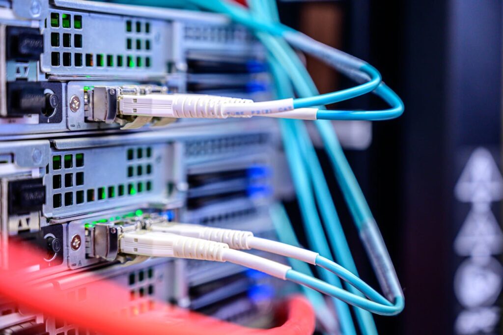 pexels-photo-2881233 Detailed shot of Ethernet cables connected to server ports highlighting technology infrastructure.